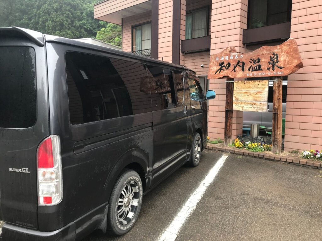 a black van parked in front of a building